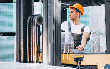 Young man working at a warehouse with boxes